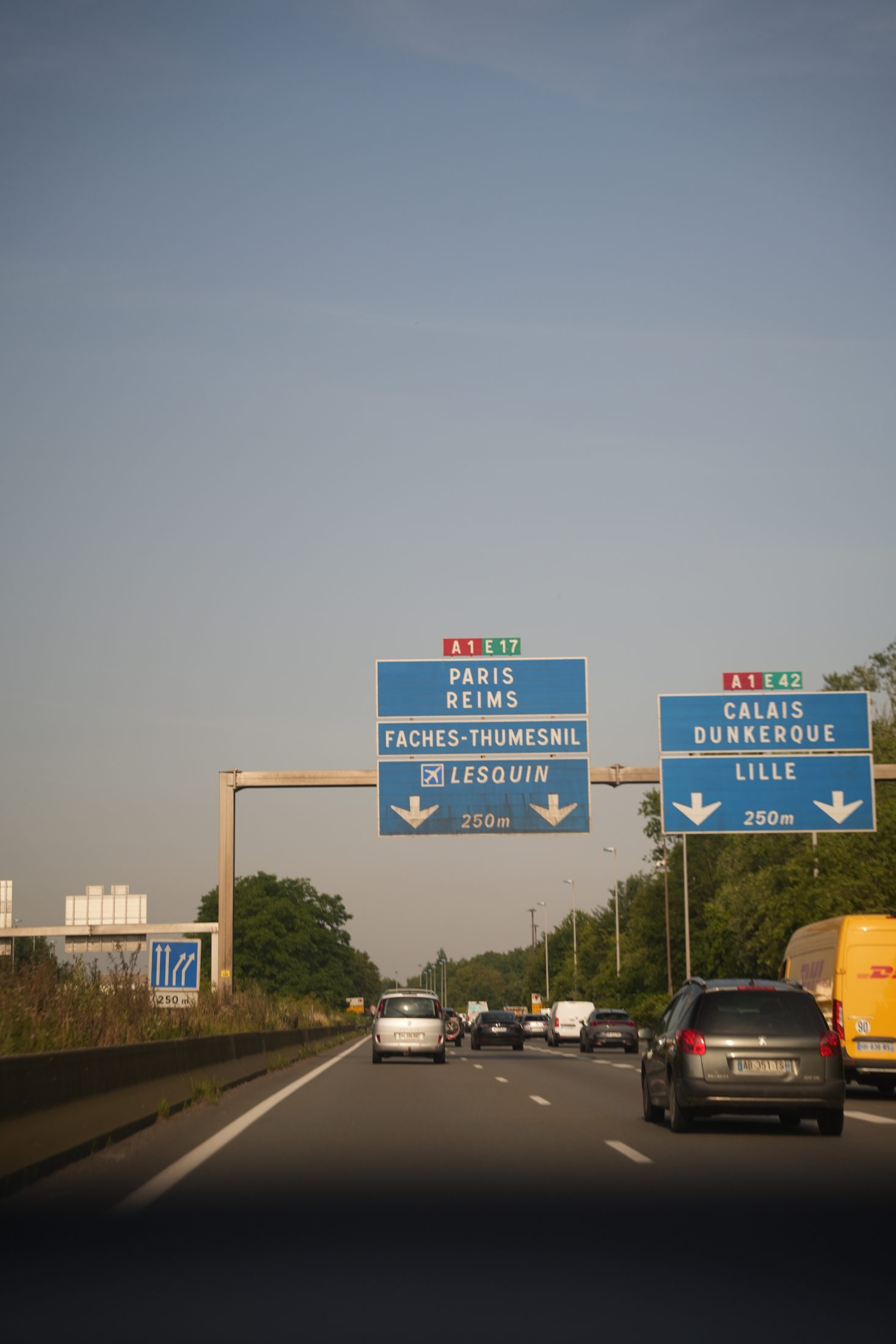 Motorway signs to Paris, Calais and Lille on a European road trip by TeamWho